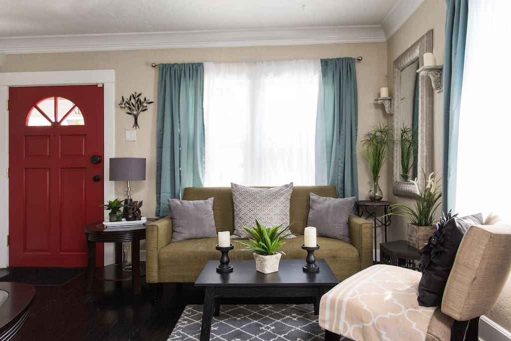 Living Room - with black hardwood floors and plenty of natural lighting. Very cool classic and contemporary!