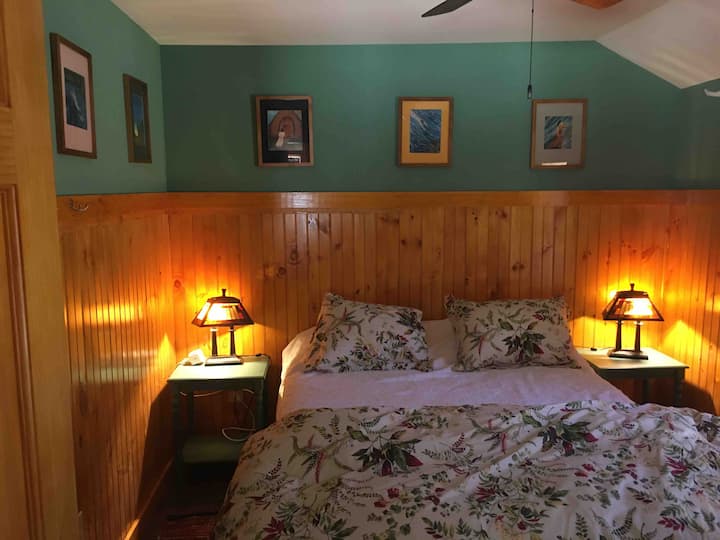 Small but charming bedroom with queen bed