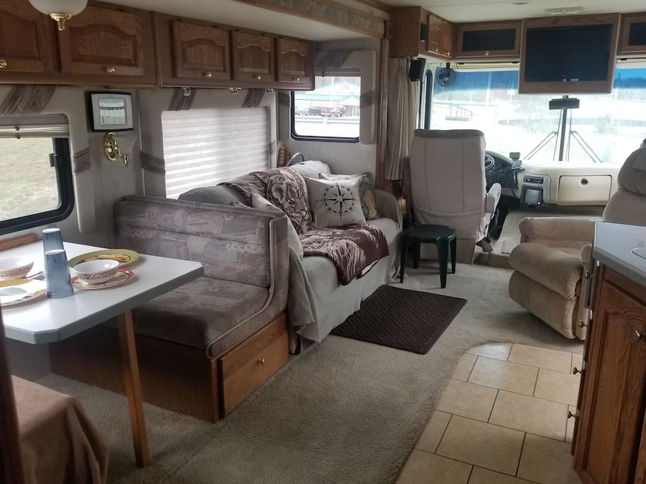 Main Living Space looking from the back forward. The couch pulls out into a full bed with linens and extra pillows.