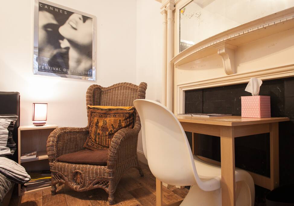 There is a study desk and chair in the room.