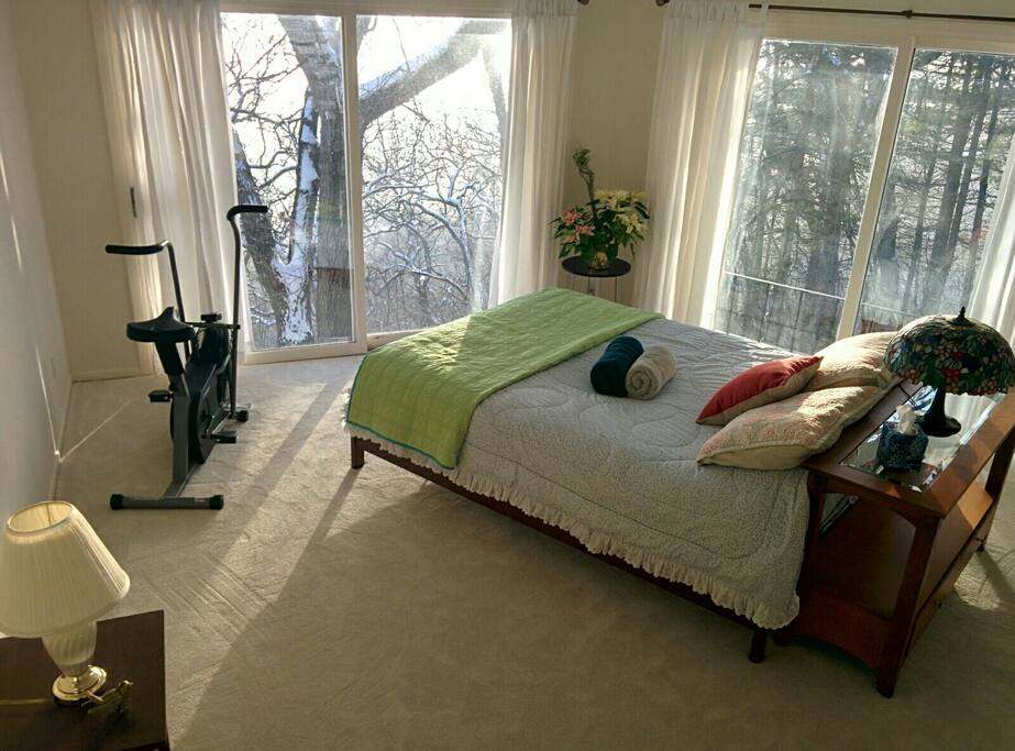 The Pink room offers a queen bed, TV with ROKU, a private bath and a panoramic view.