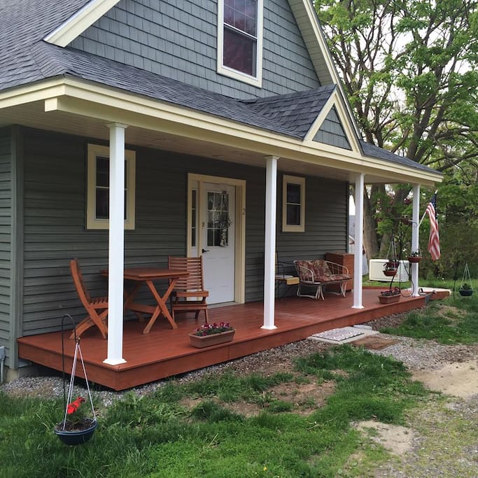 Sunrise porch for your morning cup of coffee / tea or a nice afternoon shade for some book reading time!