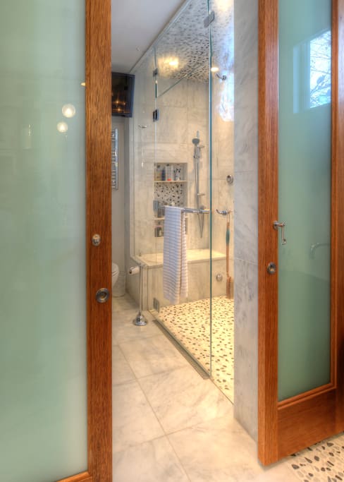 Modern remodeled shower Bathroom: double sized, his and her shower heads, separate water controls, steam shower with lounging bench, heated floors. Lounge and steam after a day of skiing or hiking! Extra large water heater for longer showers.