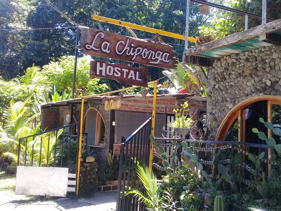 main entrance to the bungalow and sign on the road to recognize wher we are .