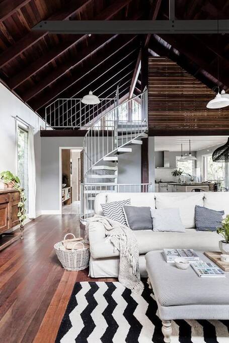 large open living area with vaulted ceiling