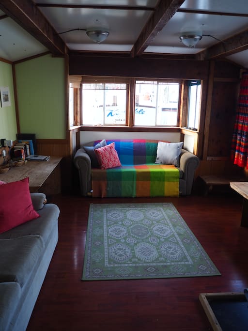 The living room, complete with a wood burning stove and pull out couch.