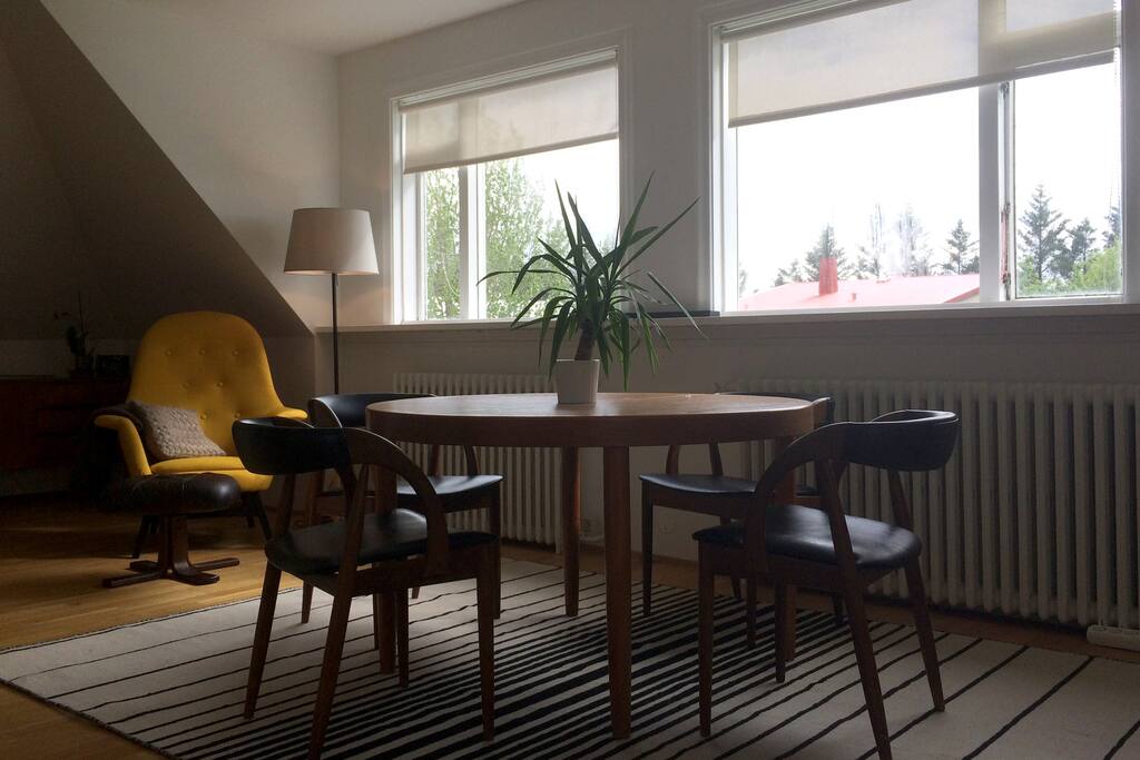 Big and bright living and dining-room area with my parents old teak furniture.