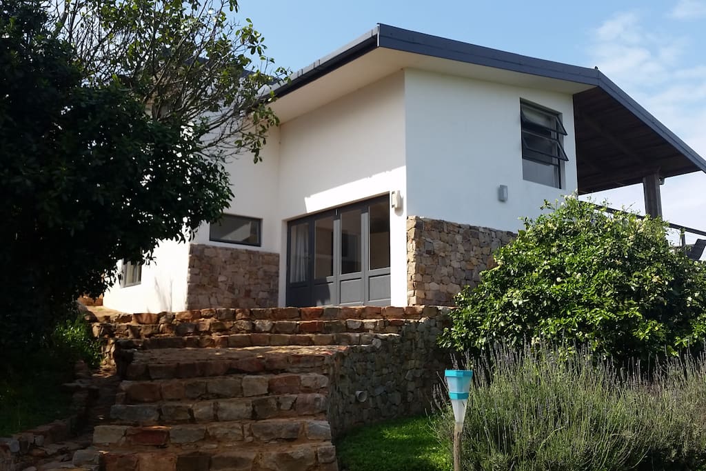 Front of the house - showing bedroom leading onto a patio