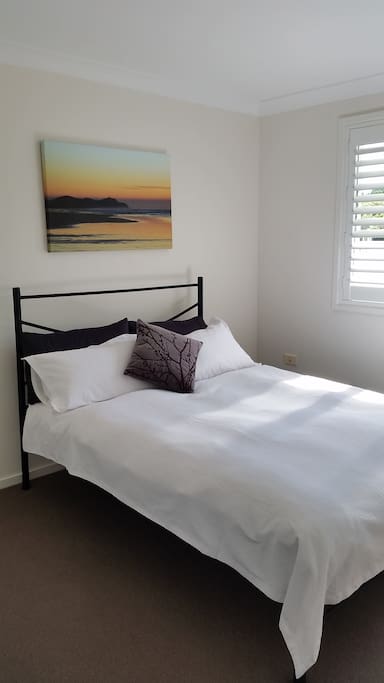 Your main bedroom on the upper level has built in cupboards and north facing windows