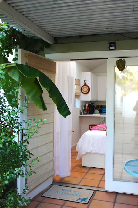 French doors open to the patio. Also includes brand-new cordless roman shades for total privacy.