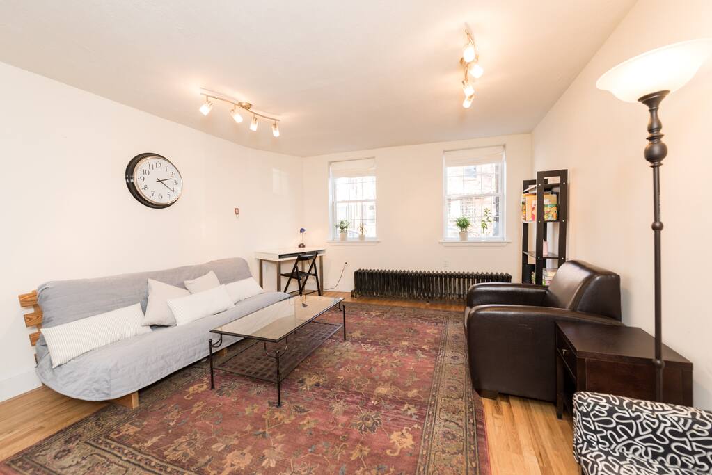 Cozy living room with natural light from large front windows