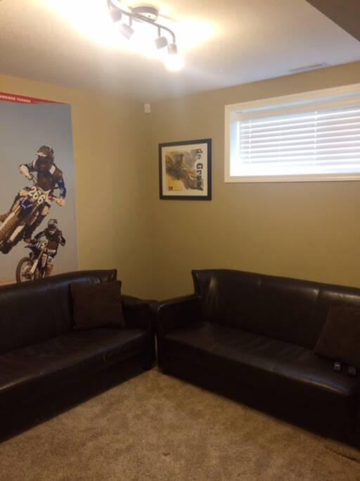 Private living space with two sofas & elliptical for those early riser exercisers