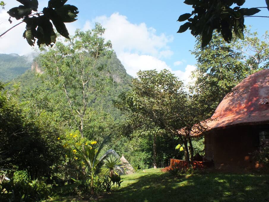 The Dome Roundhouse has a balcony, bedroom and semi-outdoor bathroom, and a spectacular view of the mountains.
