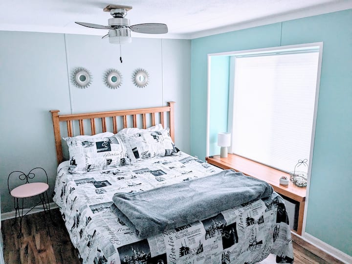 Second bedroom with queen bed double closet and stand up mirror 