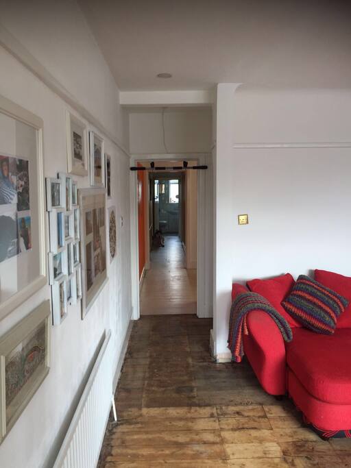 View from front door. Lounge on right with corridor leading through to kitchen then bedrooms/bathroom beyond.