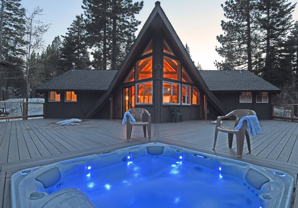 View of the back deck and hot tub in the winter months