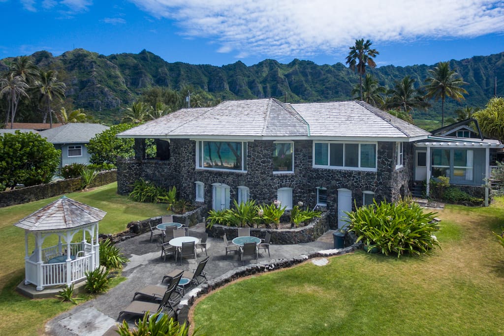 Listed on the Register of Hawaii's Historic Homes this classic restored beach house was built of lava rock during the reign of King Kalakaua.