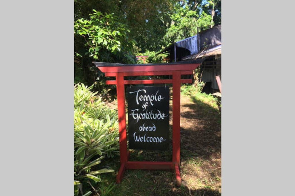 The Temple of Gratitude sign, directing guests to experience the serenity and beauty.