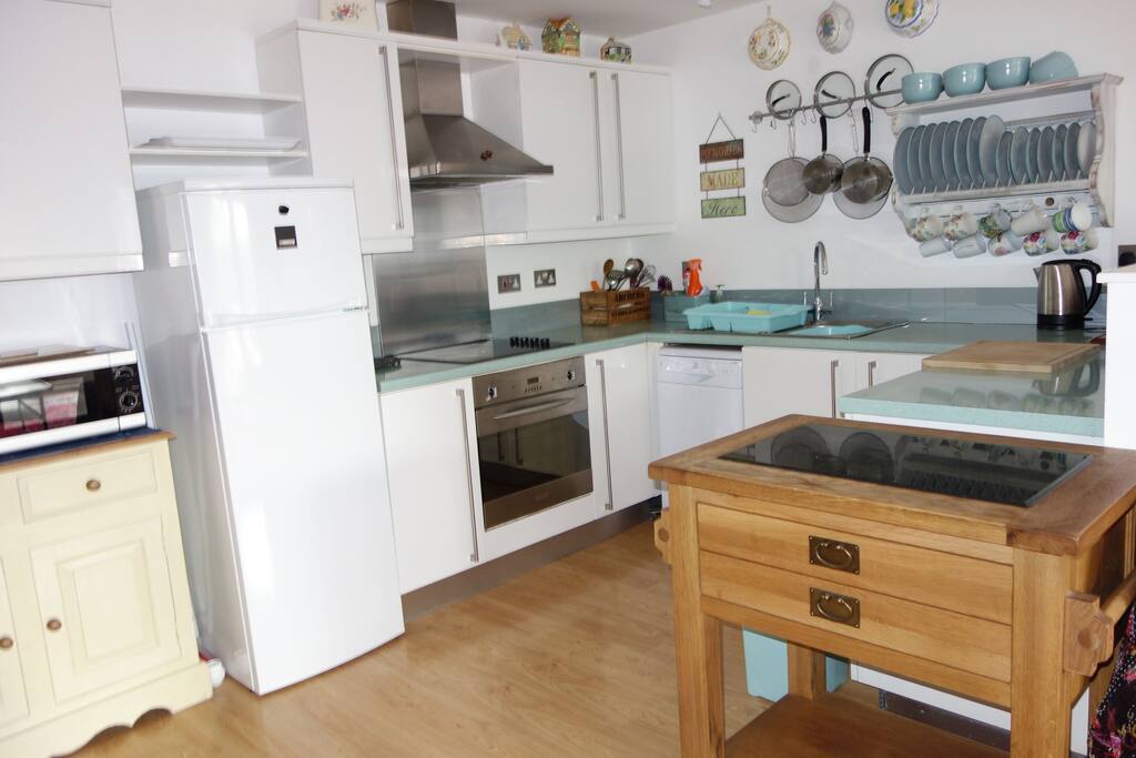 The open plan kitchen which is very well equipped