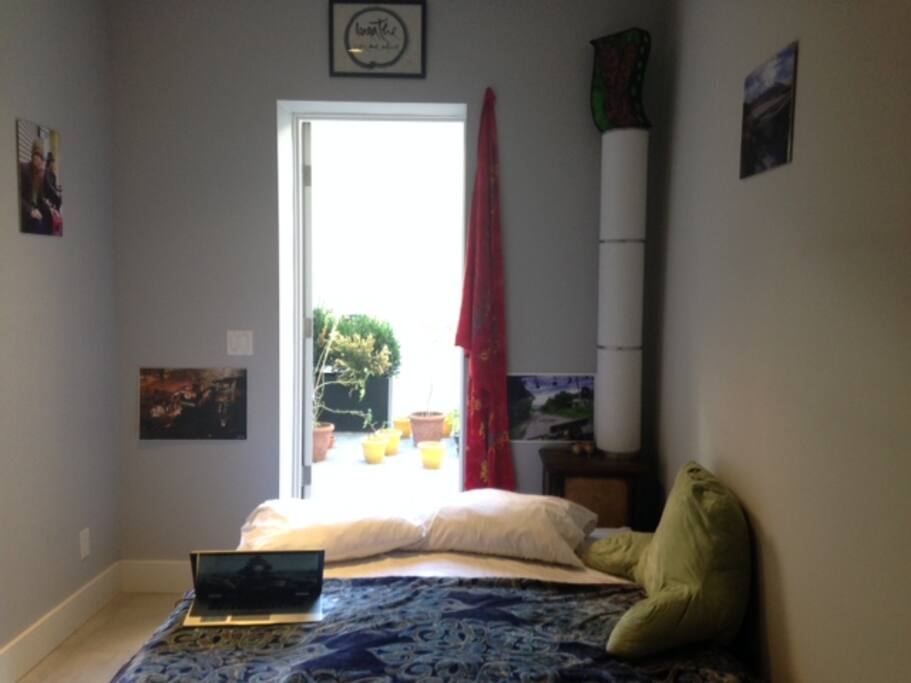 the bedroom opening to the patio