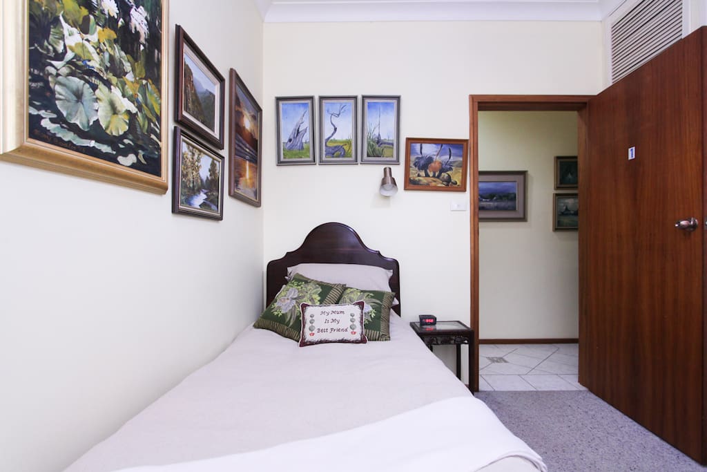 Natural landscape paintings displayed throughout the room