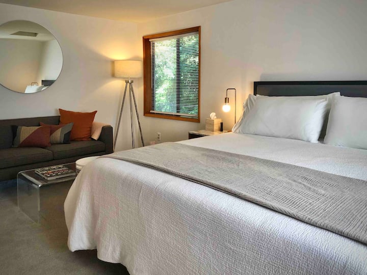 On the second floor, the Moon Room is our largest bedroom with a king bed and sitting area. A bathroom is right next door which is shared with the Rainbow Room.