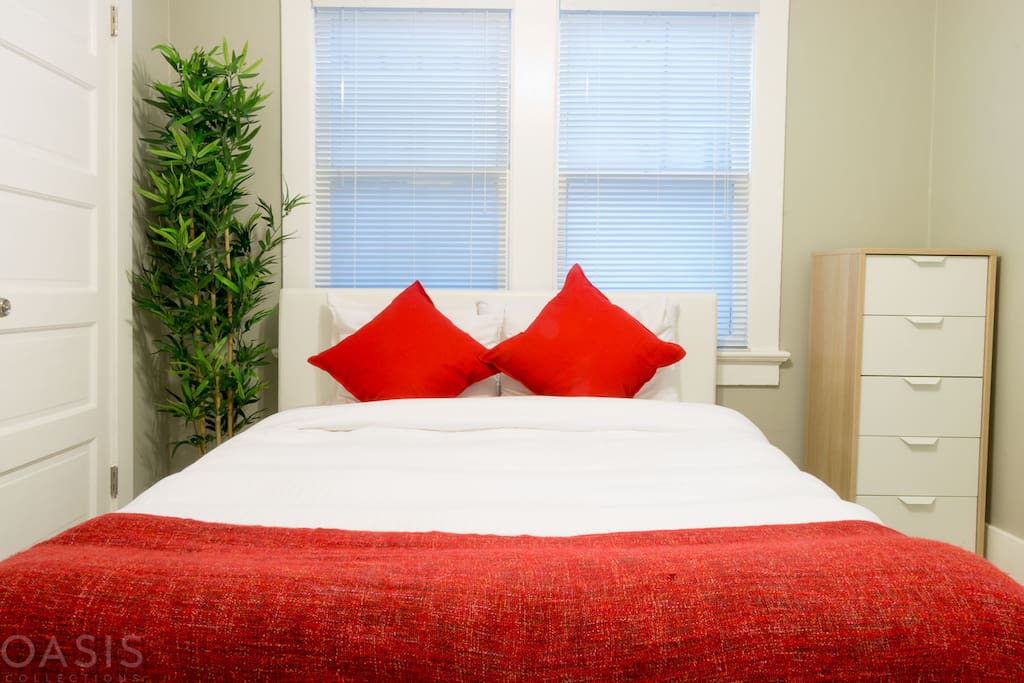 Beach inspired guest room is fun with a pop of red!