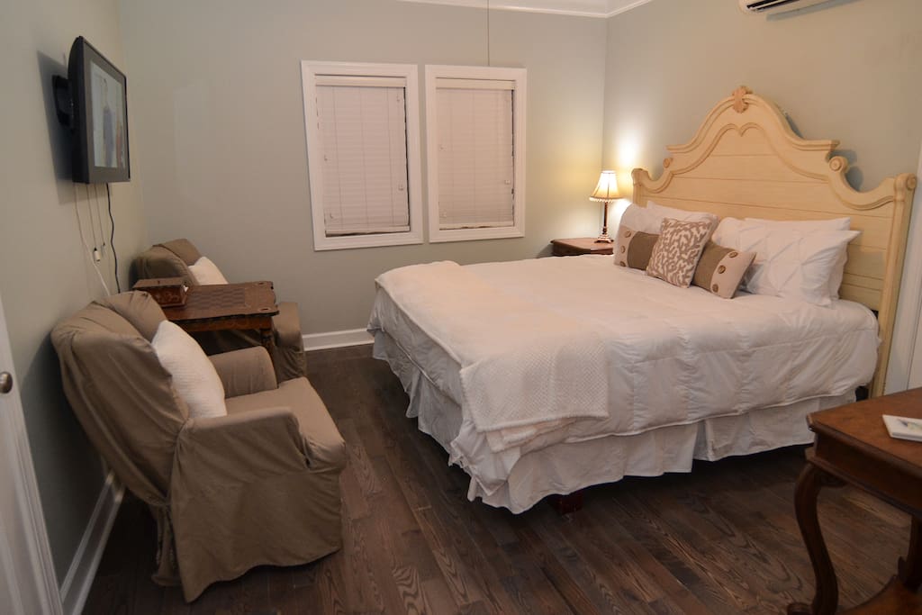 Plush king bed and comfy wingback chairs beckon one to relax