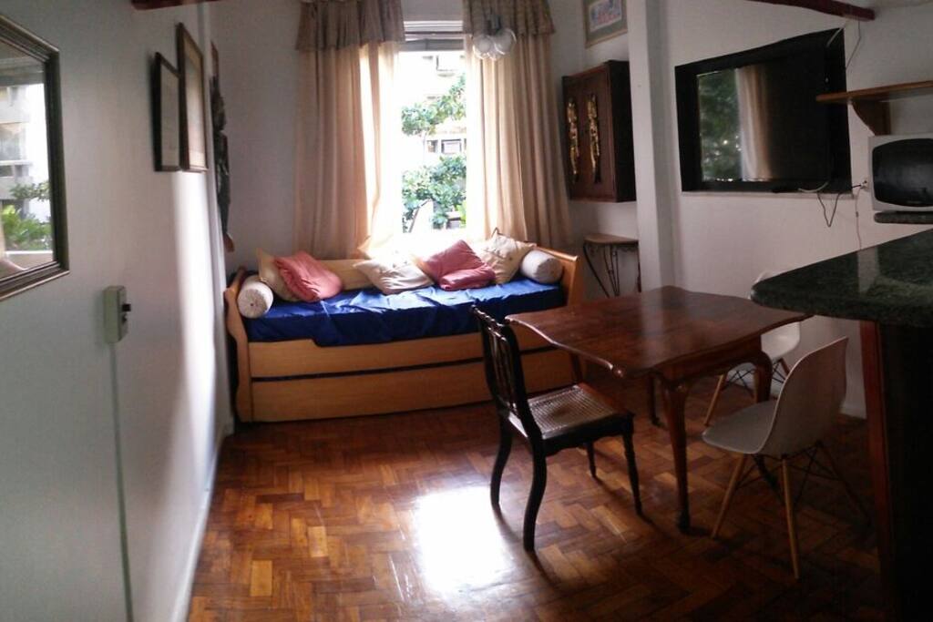 The living room receives plenty of light coming from the front window, overlooking the street.
From your living room you can gauge how bustling the street already is and if it is the right time to get out and enjoy the night life!