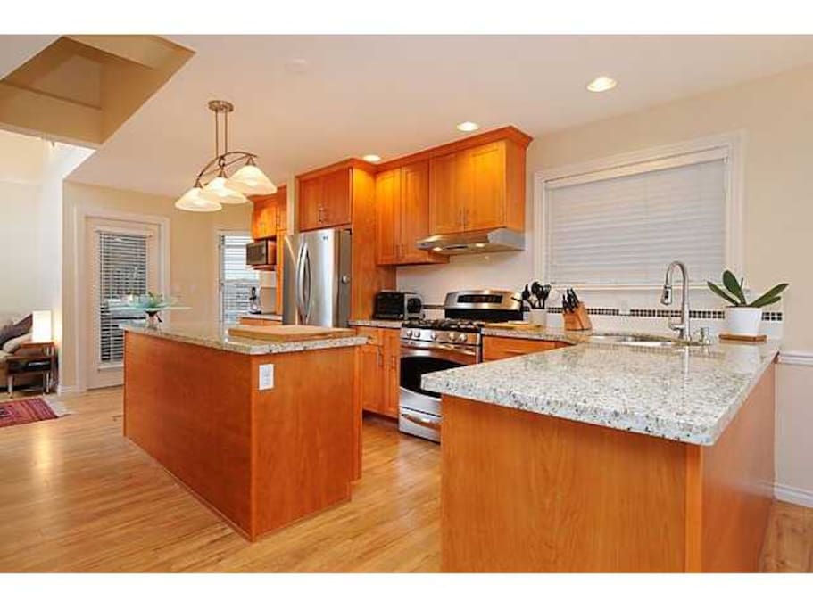 Open kitchen (bottom floor, adjacent to open-space living room area)