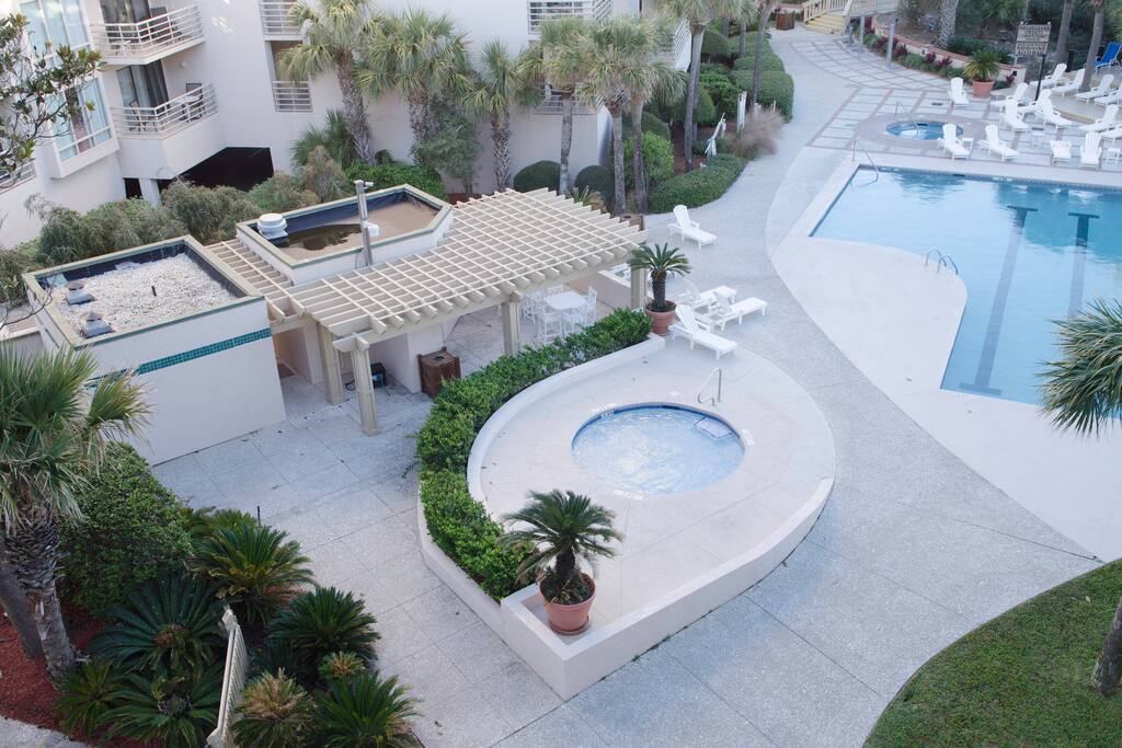 There is a hot tub and a kiddie pool adjacent to the main pool.