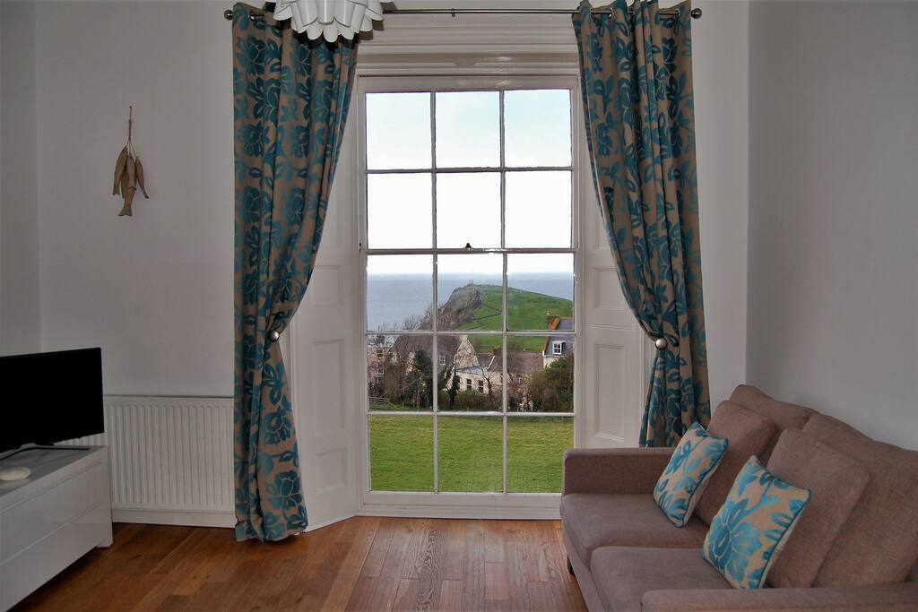 Living room with floor to ceiling windows