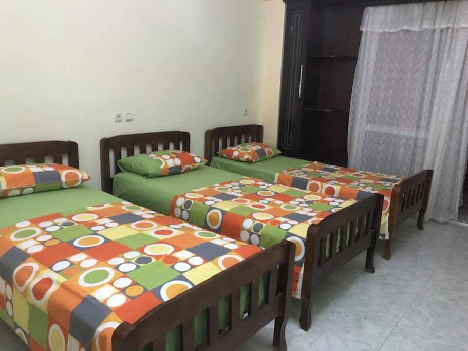 Living room with 3 single bed, tv, wifi, air condition.