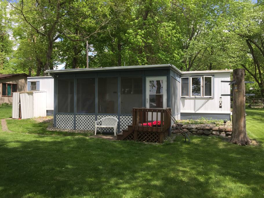 A screen porch adds space and sleeping room.