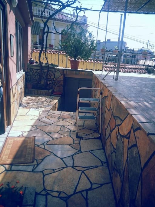 The entrance of the house, the stairs before entering the house.