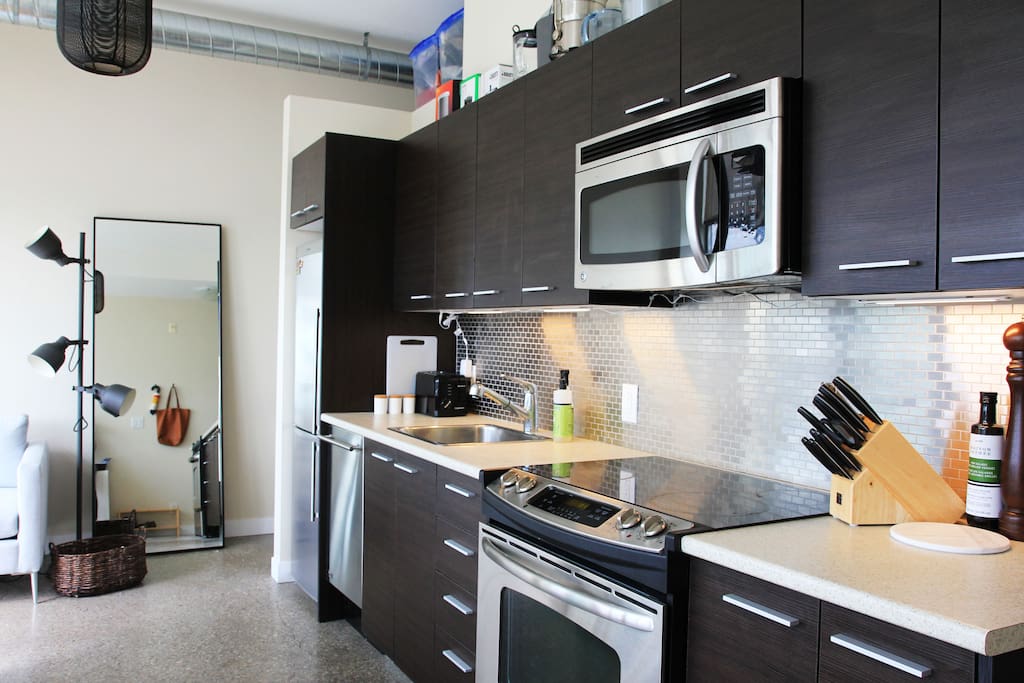 Wonderful kitchen well-stocked for cooking and food prep.