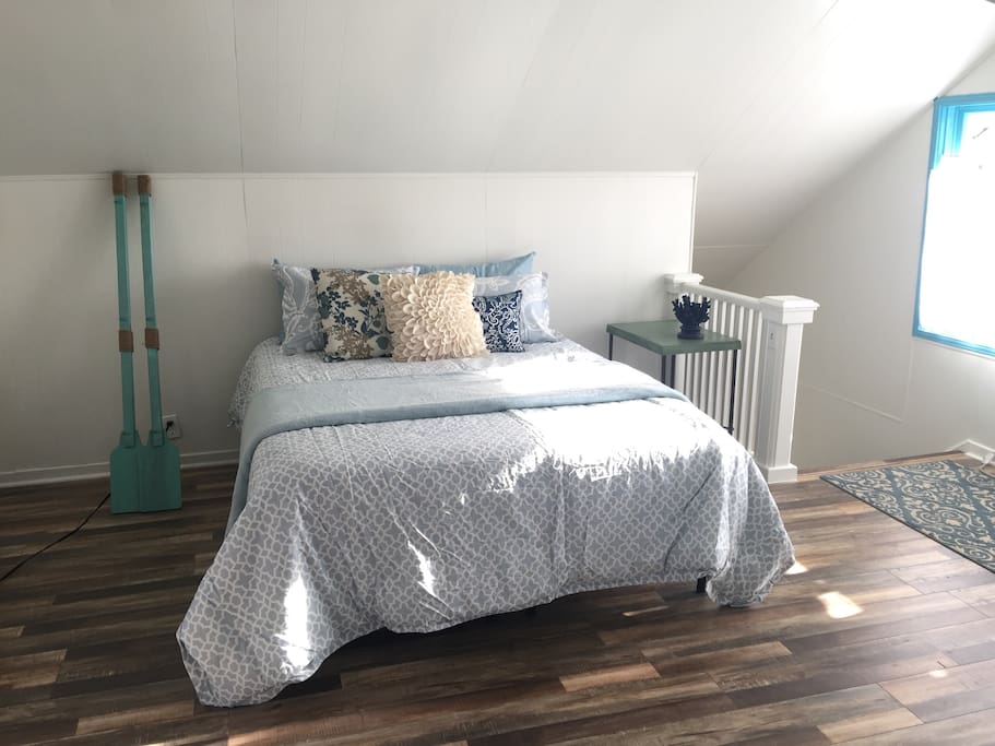 Beautiful comfortable queen size bed. Bright and airy throughout the day. Stair entry way to the right.