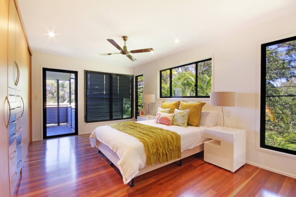 main bedroom with open plan spa bath room.