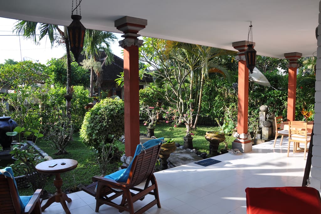 veranda with relax chairs, setting area and dinertable