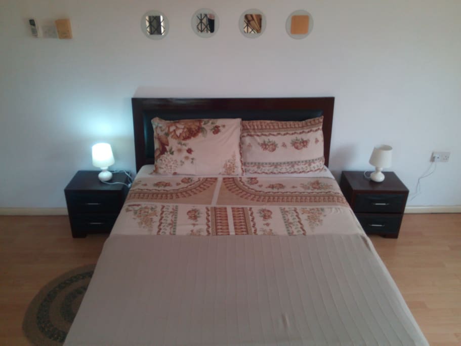 ensuite double bedroom 1 with side cabinets