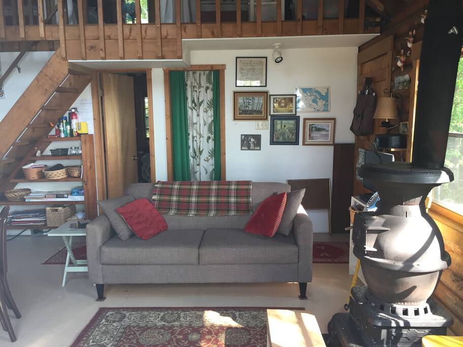 Living room with new sofa. Open to ceiling.