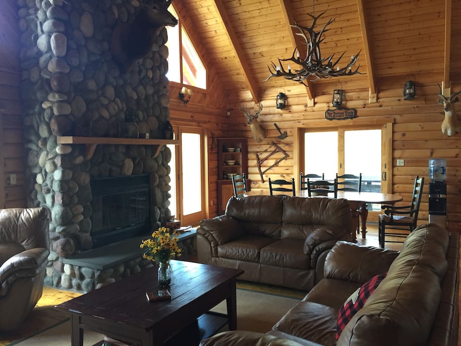 Living Room with great stone fireplace to the dining room area
