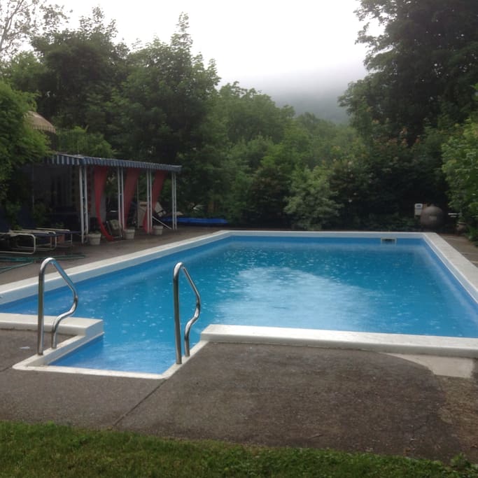 Picturesque pool in fully landscaped yard for retreat-like setting.