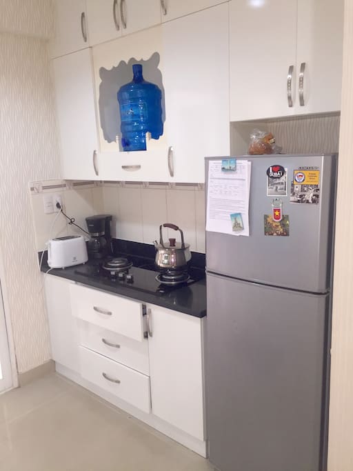 Roomy kitchen for food prep and a coffee machine as well as Vietnamese coffee equipment.