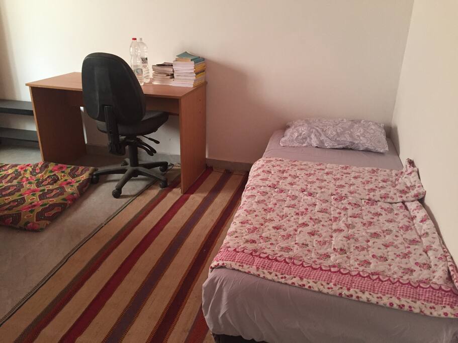 Another single bed in the other room.