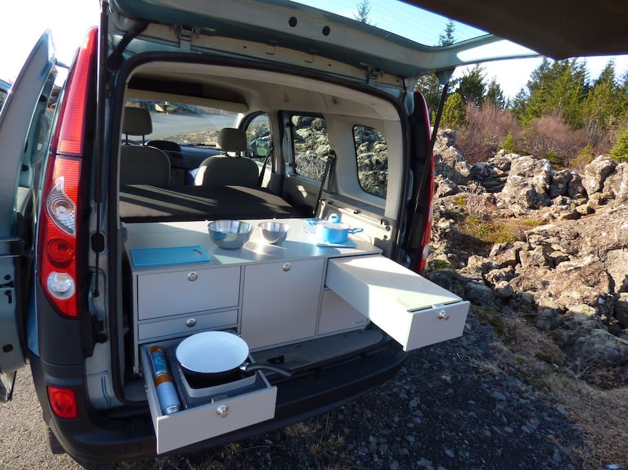 The kitchen comes fully equipped with gas stove, fridge, sink with running water, cookware, dishes, spices, cleaning equipment, etc. including a camping table & 2 chairs.