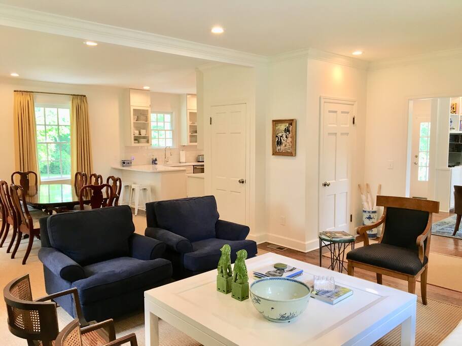 Open concept living room, dining room, and into new kitchen