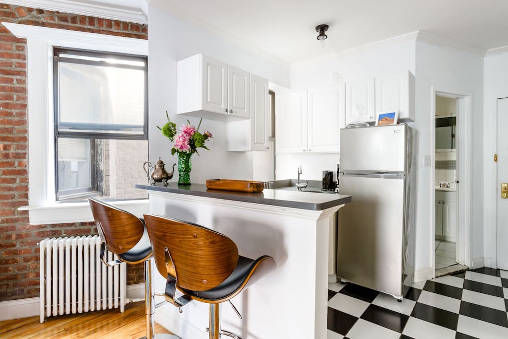 An eat-in kitchen with comfy and stylish seating