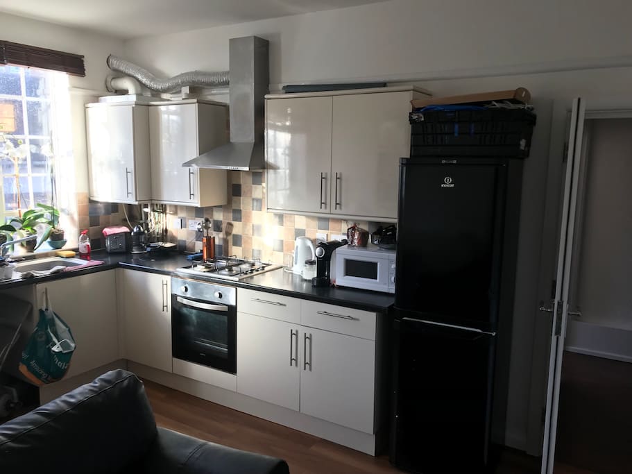 Part of the kitchen and salon.