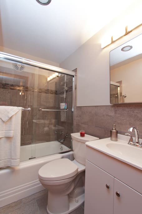 Tons of hot water, fluffy towels, body wash, shampoo & conditioner, this compact bathroom has a large medicine cabinet awaiting your personal items. Tucked under the vanity is a hair dryer & magnifying make-up mirror. Don't squeeze the Charmin!